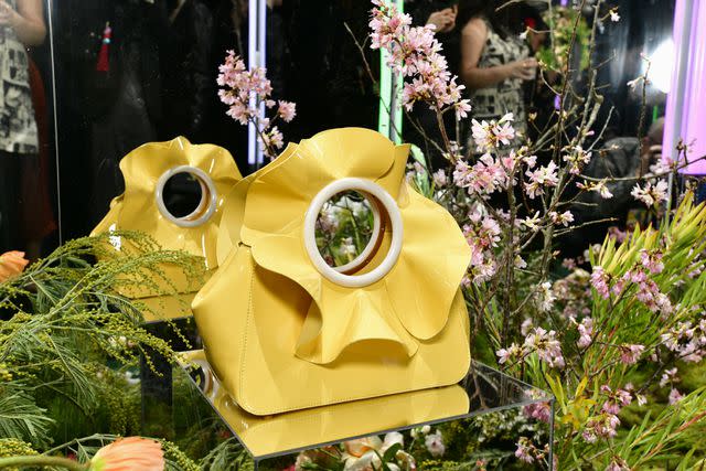 <p>Eugene Gologursky/Getty Images for NYLON</p> The Flora Patent Leather 3D Flower Top Handle Bag from the Kate Spade Time to Bloom collection.