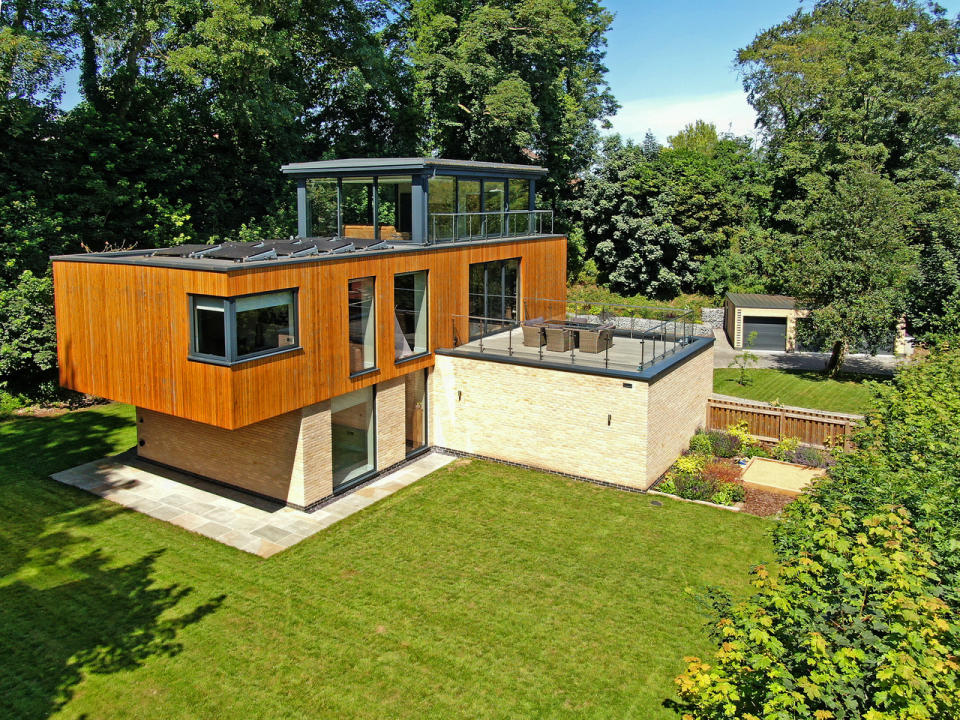 property A cantilevered first floor and glass box sitting room at the top give this eco-friendly house wow-factor. Photo: Robert Bell & Company