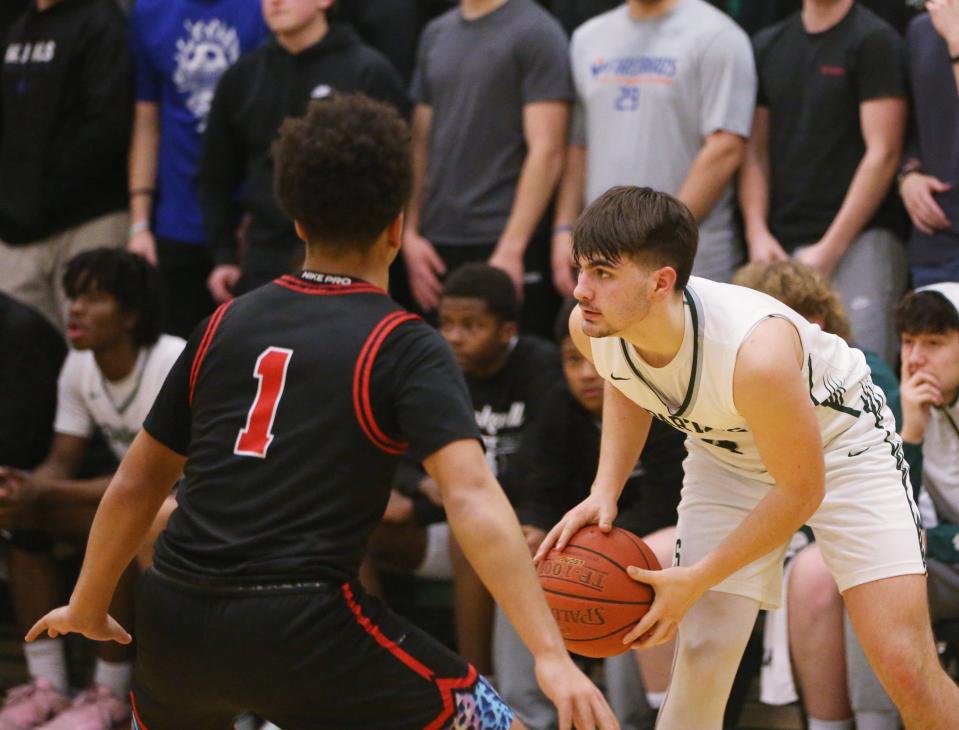 Spackenkill's Bryan Hoyt looks to pass away from Port Jervis' Isaiah Boucher during the Section 9 Class A boys basketball quarter final on February 26 2024.