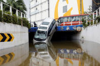 A vehicle damaged by Typhoon Hato is seen in Macau, China August 24, 2017. REUTERS/Tyrone Siu