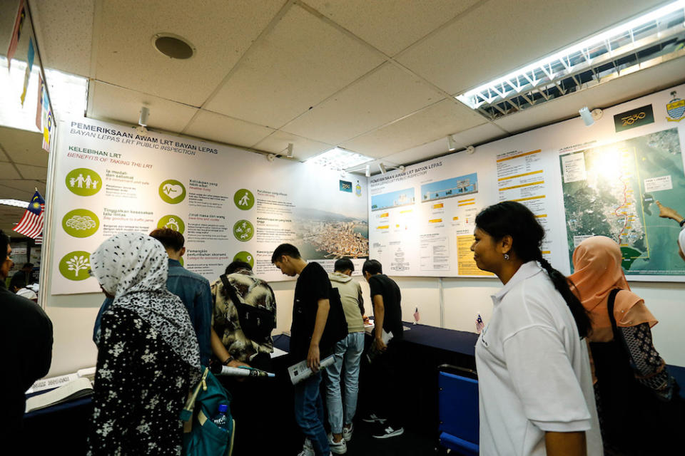 People peruse the Bayan Lepas Light Railway Transit (LRT) display and information booth at Komtar in George Town August 20, 2019. — Picture by Sayuti Zainudin