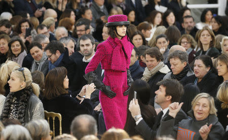 A model presents a creation by German designer Karl Lagerfeld as part of his Fall/Winter 2016/2017 women's ready-to-wear collection for fashion house Chanel at the Grand Palais in Paris, France, March 8, 2016. REUTERS/Gonzalo Fuentes