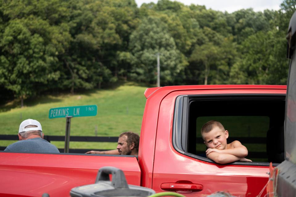 Neighbors stop to talk on the road in Guernsey County. Applications have come in to frack beneath Salt Fork State Park in Guernsey County and Wolf Run State Park in Noble County.