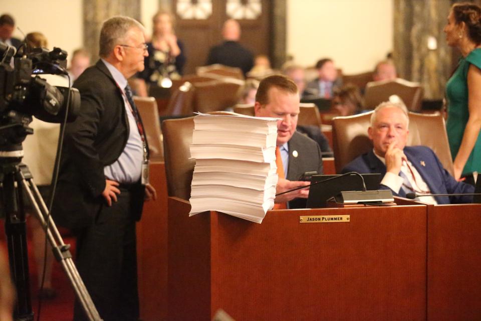 On the desk of Sen. Jason Plummer, R-Edwardsville, stands the 3,400-plus pages of the fiscal year 2024 budget on Thursday, May 25, 2023.