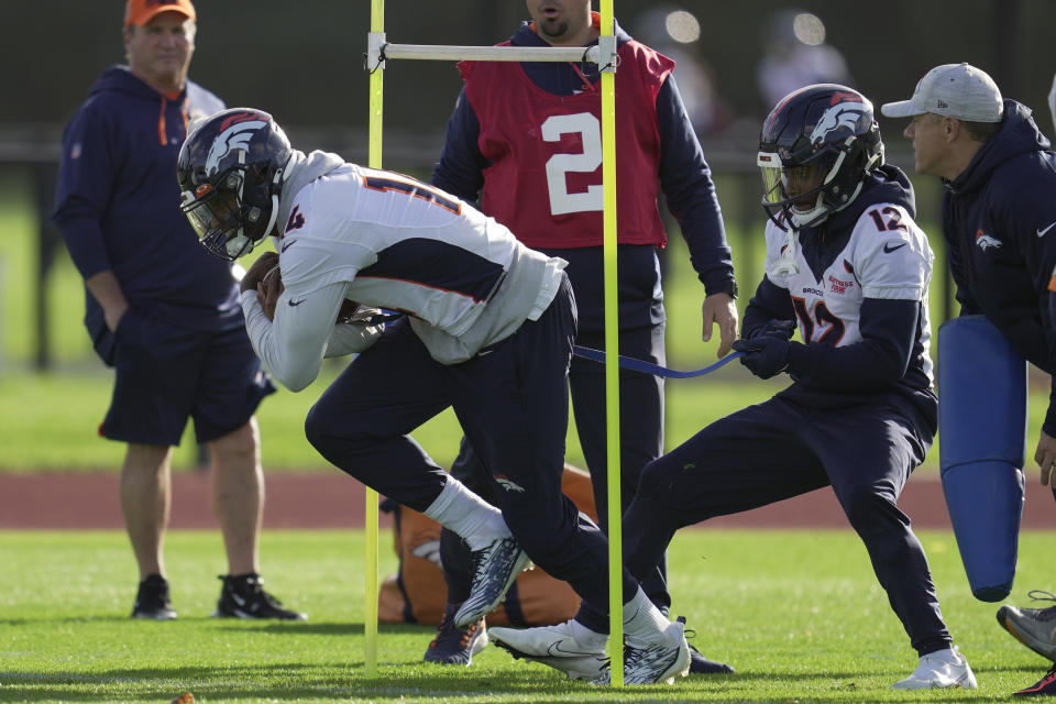 Denver Broncos Courtland Sutton, left, and Montrell Washington attend a practice session in Harrow, England, Wednesday, Oct. 26, 2022 ahead the NFL game against Jacksonville Jaguars at the Wembley stadium on Sunday. (AP Photo/Kin Cheung)