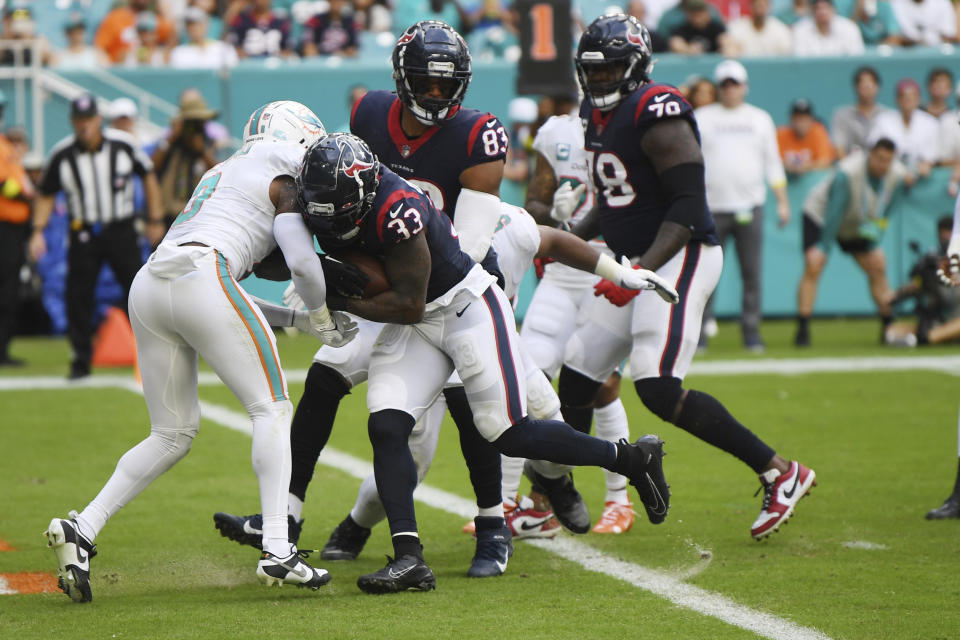 Houston Texans running back Dare Ogunbowale (33) scores a touchdown during the second half of an NFL football game against the Miami Dolphins, Sunday, Nov. 27, 2022, in Miami Gardens, Fla. (AP Photo/Michael Laughlin)