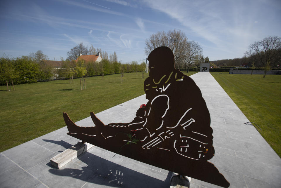 A temporary iron sculpture of Australian World War I soldiers John "Jack" and Jim Hunter sits atop the Brothers in Arms Memorial in Zonnebeke, Belgium, Thursday, April 22, 2021. The bronze statue of the Hunter brothers, currently being cast and created by Australian sculptor Louis Lauman, will form the main feature of the Brothers In Arms Memorial Park, located near the site where John "Jack" Hunter's body was discovered during roadworks in 2006. On another Anzac Day turned lonesome by the global pandemic, solitary actions show all the more how the sacrifices of Australia and New Zealand during World War I are far from forgotten. (AP Photo/Virginia Mayo)