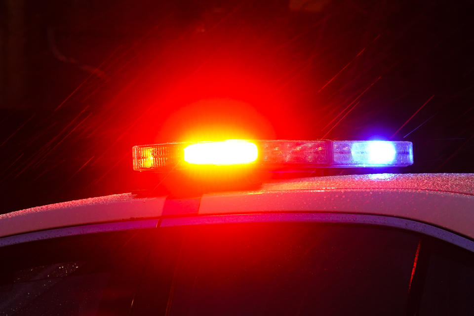 FILE - Shown is a Philadelphia police car with flashing lights in Philadelphia, Monday, Jan. 17, 2022. Police departments reported a year-over-year increase in sworn officers in 2023 for the first time since the COVID-19 pandemic began and since the 2020 police killing of George Floyd spurred nationwide protests and increased scrutiny of police, according to a survey released by the Police Executive Research Forum. (AP Photo/Matt Rourke, File)