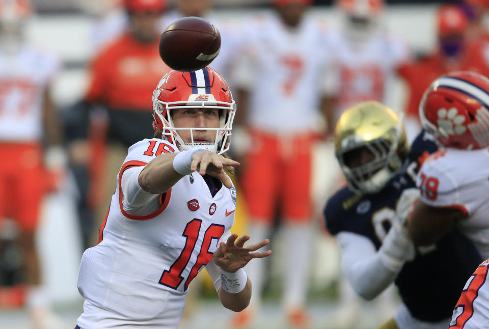 Clemson quarterback Trevor Lawrence (16) throws to an open receiver during the first half of the Atlantic Coast Conference championship NCAA college football game against Notre Dame, Saturday, Dec. 19, 2020, in Charlotte, N.C. (AP Photo/Brian Blanco)