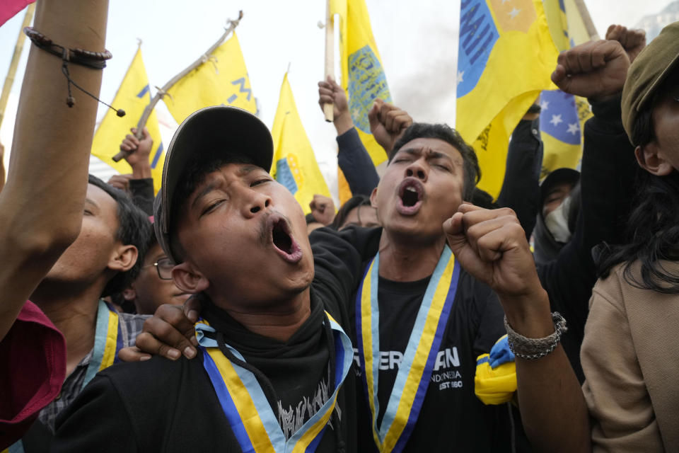 Student activists shout slogan during a rally against fuel price hikes in Jakarta, Indonesia, Monday, Sept. 5, 2022. Fuel prices increased by about 30 percent across Indonesia on Saturday after the government reduced some of the costly subsidies that have kept inflation in Southeast Asia's largest economy among the world's lowest. (AP Photo/Tatan Syuflana)