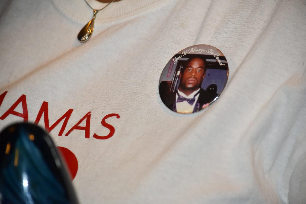 Bobbie Woods wore a pin showing the face of her son Terrill, who was only 28 when someone shot and killed him in a restaurant in downtown South Bend.