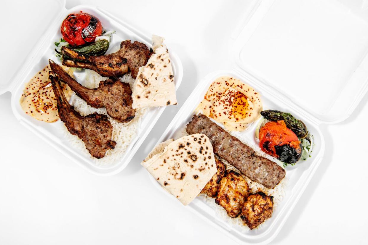 An overhead photo of lamb chops and the chicken lule kabob in white styrofoam containers