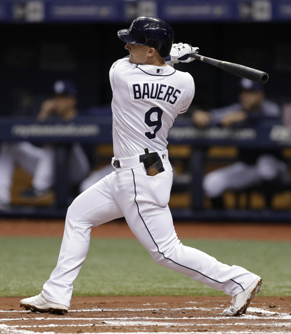 FILE - In this Aug. 8, 2018, file photo, Tampa Bay Rays' Jake Bauers bats during the first inning of a baseball game against the Baltimore Orioles, in St. Petersburg, Fla. Edwin Encarnacion has been traded to Seattle and first baseman Carlos Santana has returned to the Indians in a three-team deal that also involved Tampa Bay. The Rays got infielder Yandy Diaz and minor league right-hander Cole Slusser from Cleveland. The Indians also acquired first baseman Jake Bauers. The swap came Thursday, Dec. 13, 2018, at the close of the winter meetings. (AP Photo/Chris O'Meara, File)