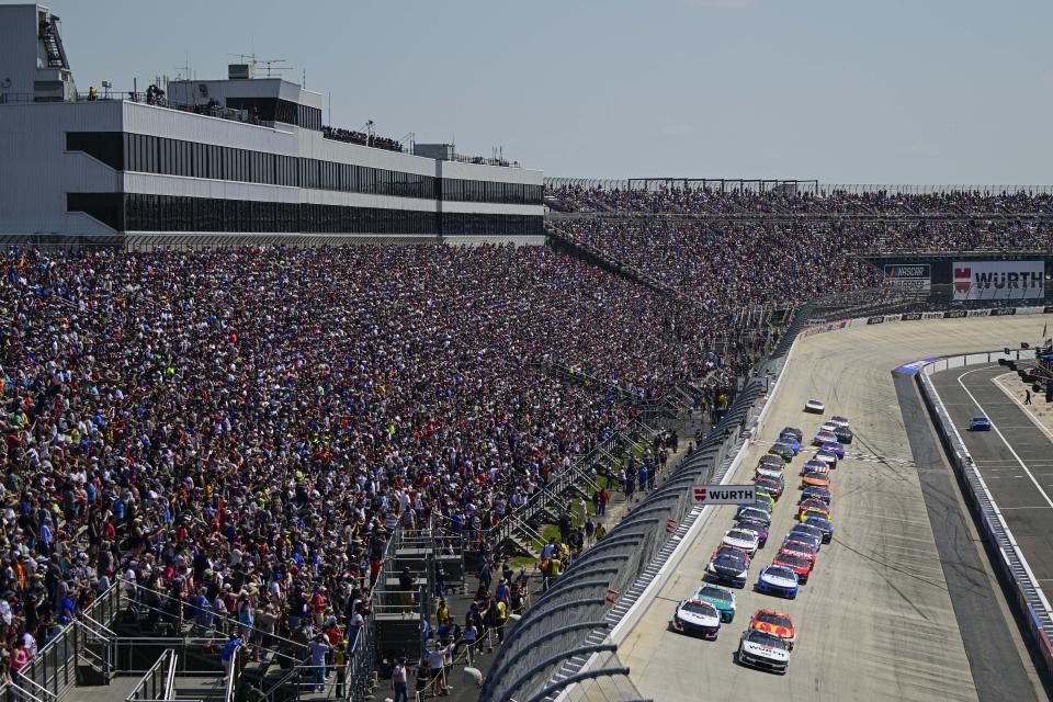 William Byron (24) leads the field into Turn 1 on a restart during a NASCAR Cup Series auto race at Dover Motor Speedway, Sunday, April 28, 2024, in Dover, Del. (AP Photo/Derik Hamilton)