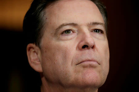 FILE PHOTO: FBI Director James Comey arrives to testify before a Senate Judiciary Committee hearing on "Oversight of the Federal Bureau of Investigation" on Capitol Hill in Washington, U.S., May 3, 2017. REUTERS/Kevin Lamarque/File Photo