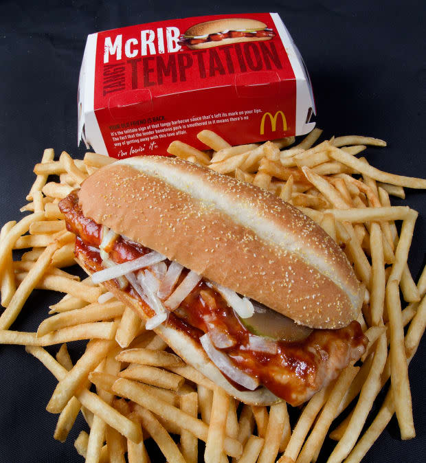 A photo of a McDonalds' McRib sandwich is seen atop French fries, November 2, 2010. AFP Photo/Paul J. Richards (Photo credit should read PAUL J. RICHARDS/AFP via Getty Images)<p><a href="https://www.gettyimages.com/detail/106449554" rel="nofollow noopener" target="_blank" data-ylk="slk:PAUL J. RICHARDS/Getty Images;elm:context_link;itc:0;sec:content-canvas" class="link ">PAUL J. RICHARDS/Getty Images</a></p>