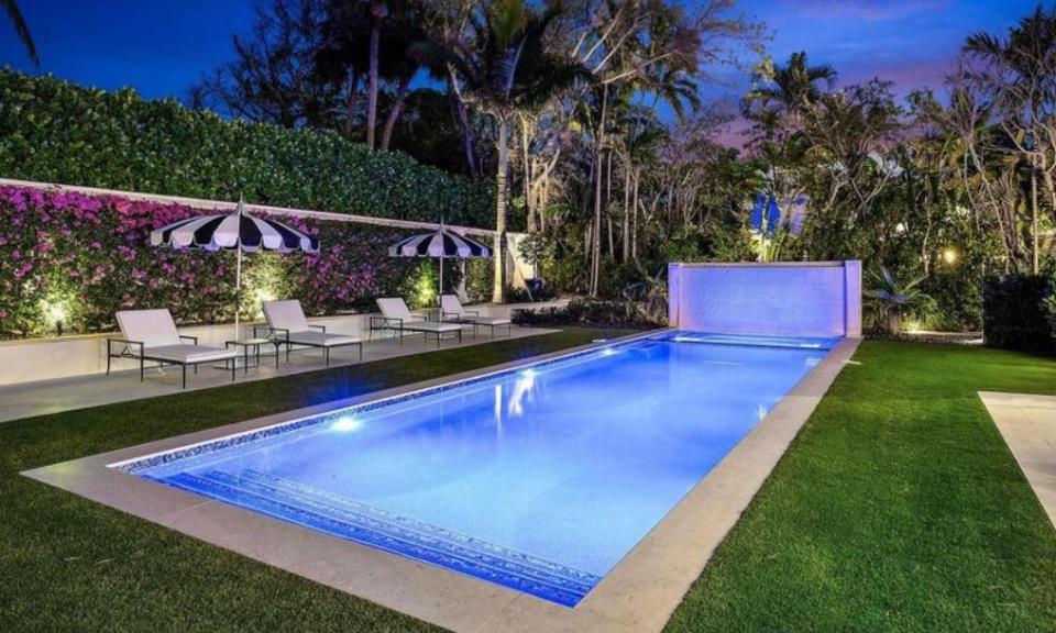 Lounge chairs face the pool at a renovated house at 150 El Vedado Road in Palm Beach, which just entered the market at $35 million.