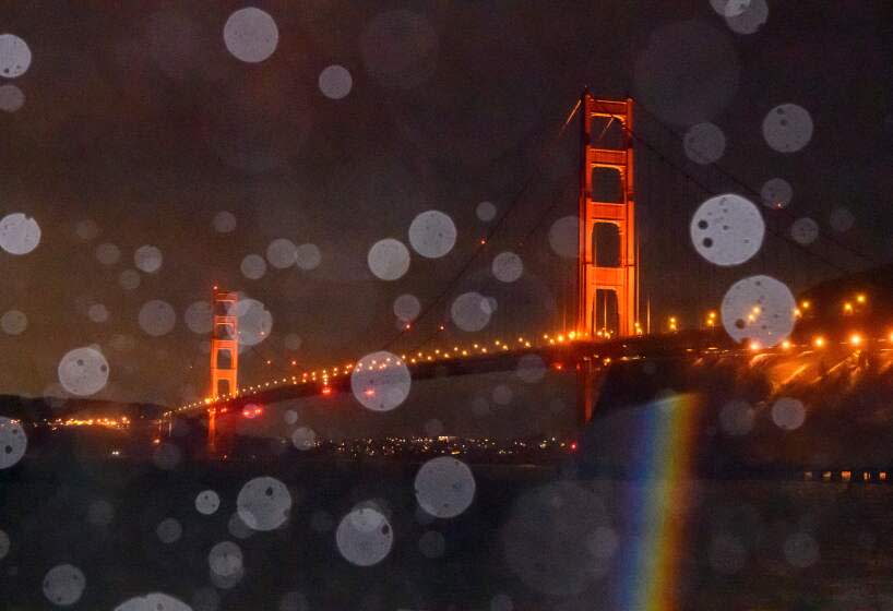 The Golden Gate Bridge is seen through a mix of rain and splashing bay water in Sausalito, California on January 5, 2023. - Damaging winds, excessive rainfall and extremely heavy snow are expected to wallop California and southern Oregon through January 5 as a series of winter storms rip across the western US coast, prompting the Golden State's governor to declare an emergency. (Photo by JOSH EDELSON / AFP) (Photo by JOSH EDELSON/AFP via Getty Images)