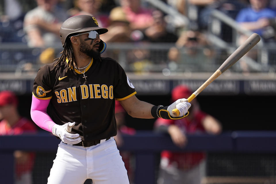 FILE - San Diego Padres' Fernando Tatis Jr. prepares to bat during the fifth inning of a spring training baseball game against the Cincinnati Reds, March 8, 2023, in Peoria, Ariz. On Thursday, April 20, in downtown Phoenix, Tatis will be announced as the leadoff hitter for the Padres and settle into a batter's box in the big leagues for the first time since the end of the 2021 season. (AP Photo/Abbie Parr, File)