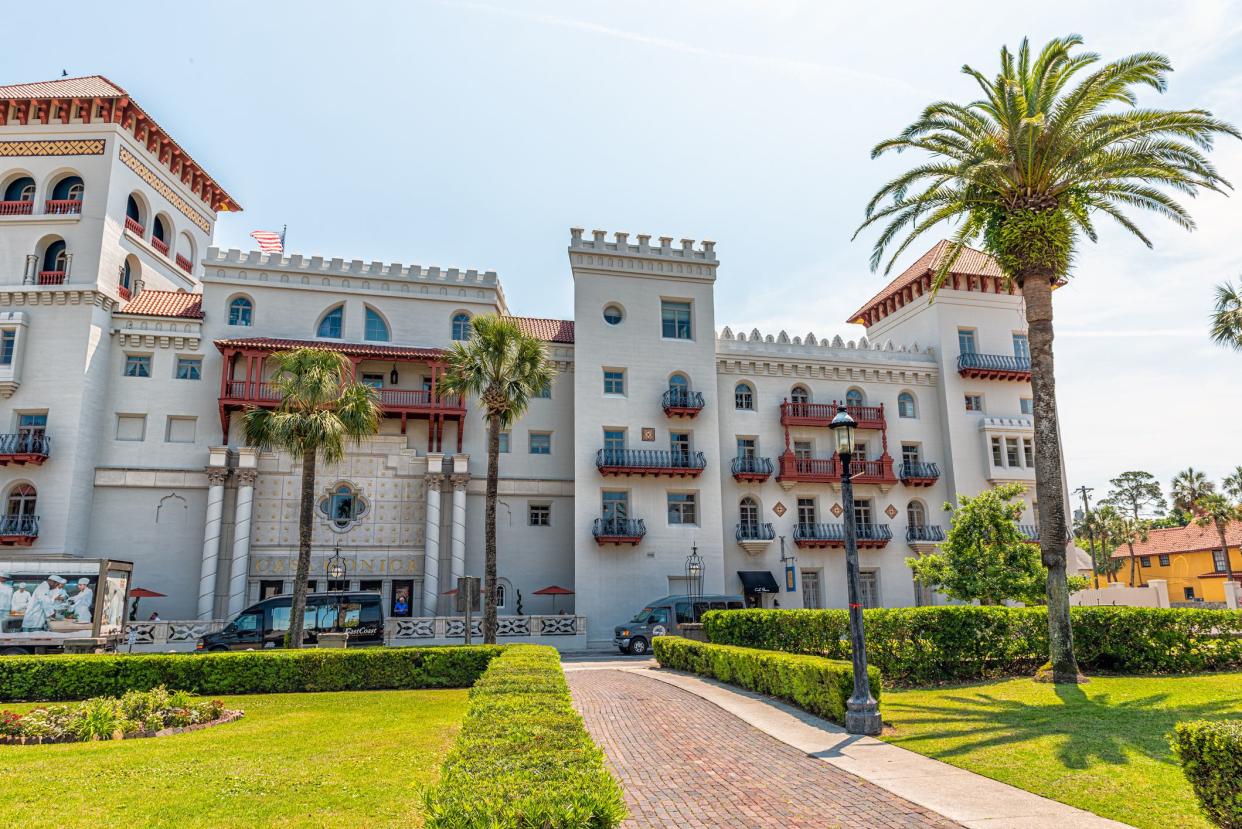 St. Augustine, USA - May 10, 2018: Casa Monica resort and spa building exterior on sunny day in historic city and palm tree