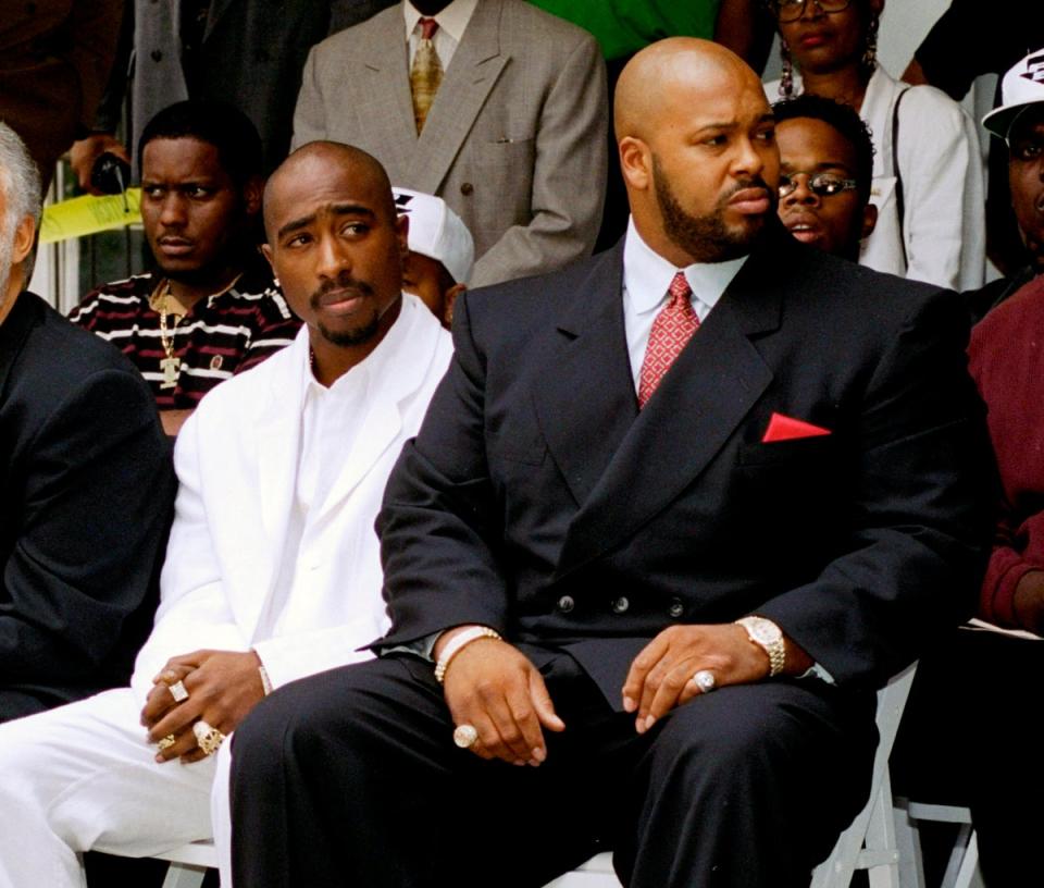 FILE - Rapper Tupac Shakur, left, and Death Row Records Chairman Marion Suge Knight, attend a voter registration event in South Central Los Angeles, on Aug. 15, 1996. (AP)