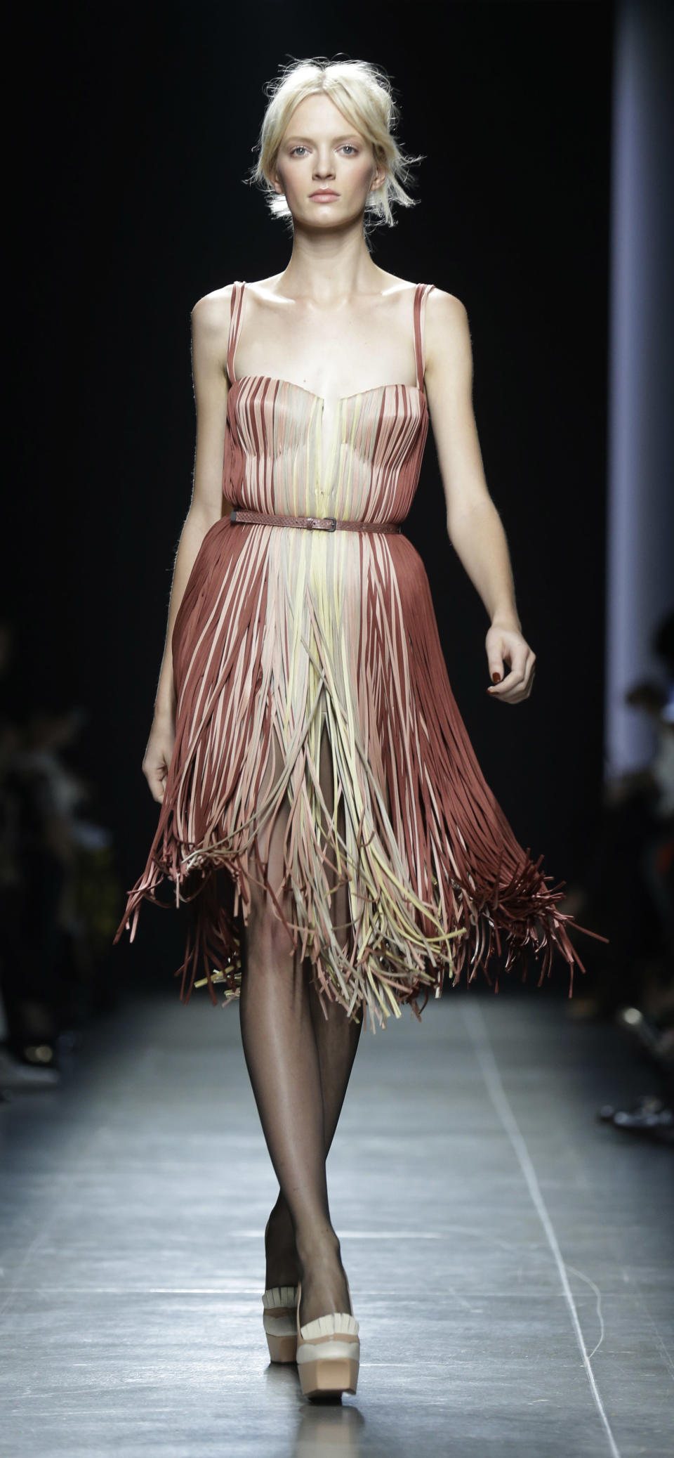 A model wears a creation part of the Bottega Veneta women's Spring-Summer 2013 collection that was presented in Milan, Italy, Saturday, Sept. 22, 2012.(AP Photo/Luca Bruno)