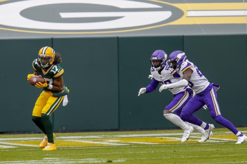Green Bay Packers' Davante Adams catckes a touchdown pass during the first half of an NFL football game against the Minnesota Vikings Sunday, Nov. 1, 2020, in Green Bay, Wis. (AP Photo/Matt Ludtke)