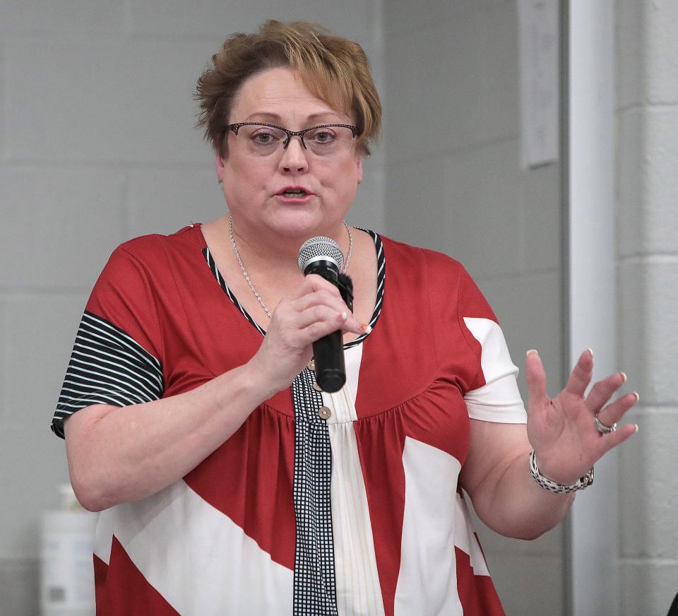 Hartville Village council member Sherry Chambers answers questions at a special meeting looking at options for the future of their police force.