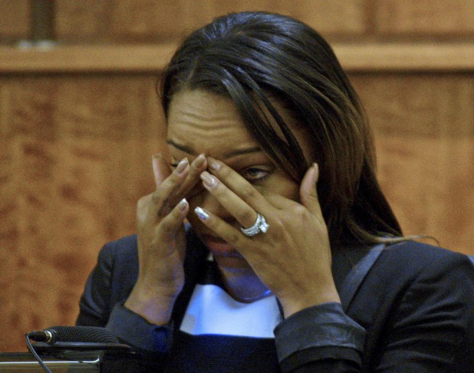 Shayanna Jenkins, fiancee of former NFL player Aaron Hernandez reacts during testimony in his murder trial in Fall River Massachusetts, March 30, 2015. Jenkins said she disposed of a cardboard box from their Massachusetts home at his request the day after prosecutors say he fatally shot an associate. REUTERS/Ted Fitzgerald/Pool