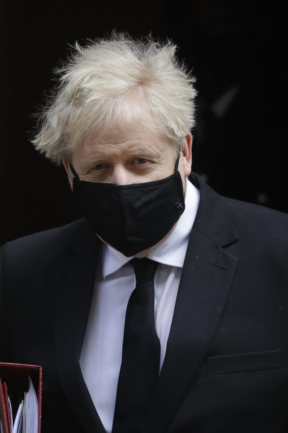 Britain's Prime Minister Boris Johnson leaves 10 Downing Street to attend the weekly session of Prime Ministers Questions in Parliament in London, Wednesday, April 14, 2021. (AP Photo/Kirsty Wigglesworth)