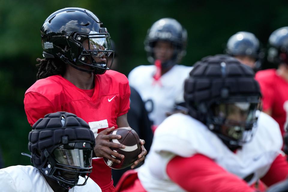 Emory Jones showed great command of UC's offense in a scrimmage Saturday, Aug. 12. Jones was able to get the Bearcats in the end zone with his arm and his legs.