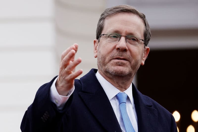 Israel's President Isaac Herzog waves during a visit to Federal President Steinmeier in Bellevue Palace. Carsten Koall/dpa