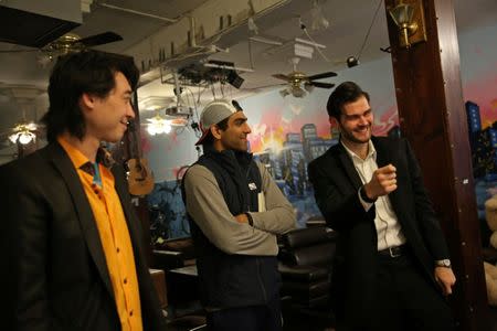 Zander Dejah (L), 25, a Virtual Reality engineer, Vish Arya (C), 26, an operations analyst and Andrew Frawley, 23, hang out in the common area of their house in San Francisco, California, U.S. January 28, 2017. REUTERS/Gabrielle Lurie