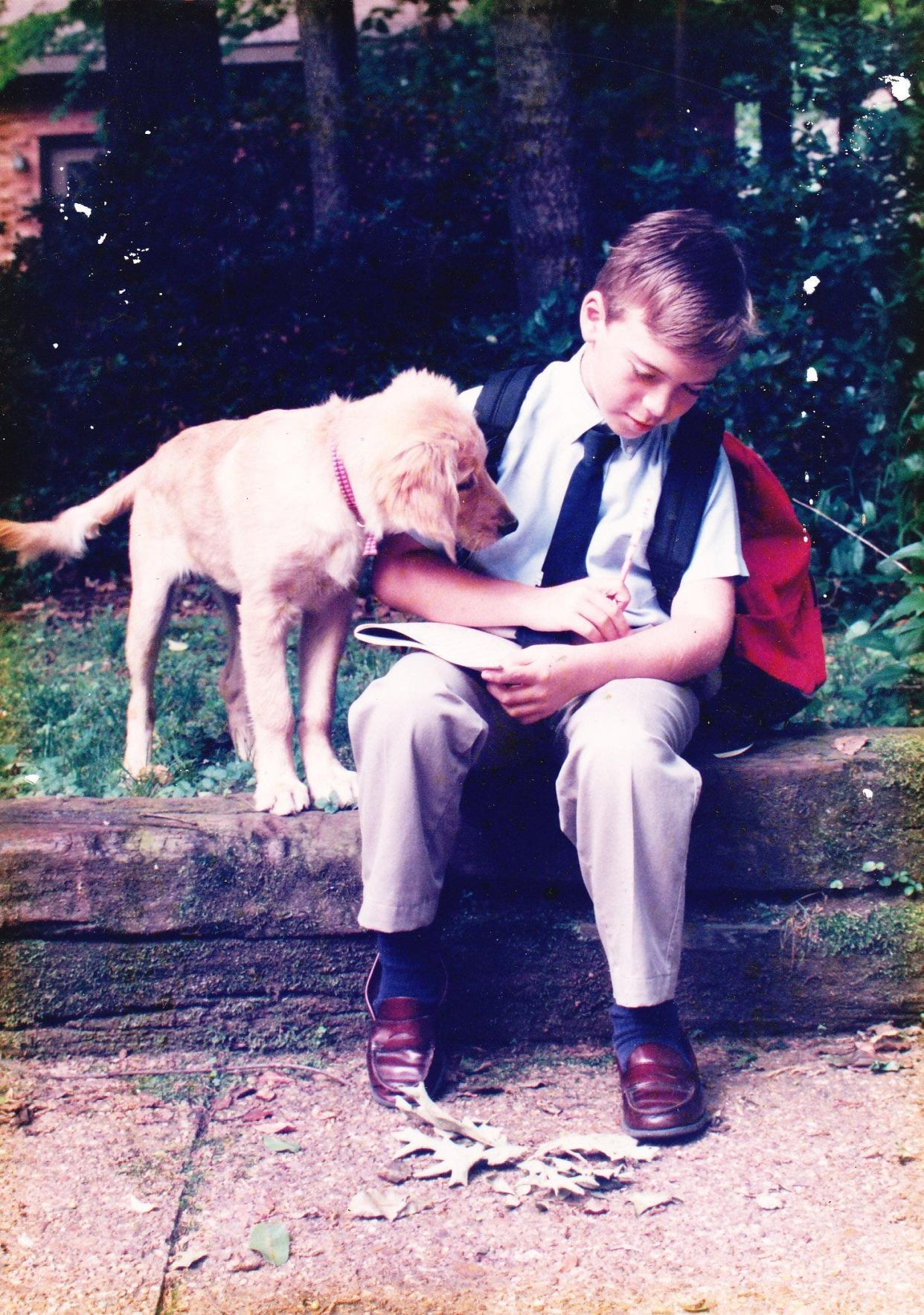 Greg Marquis, the son of this column's authors, is pictured at age 8 with his beloved dog, Shiloh. After suffering his first psychotic break in college, the young man was eventually diagnosed with schizophrenia and Asperger's Syndrome. Now nearing 40, his parents have spent decades chronicling their nightmarish journey through Florida's mental health system.