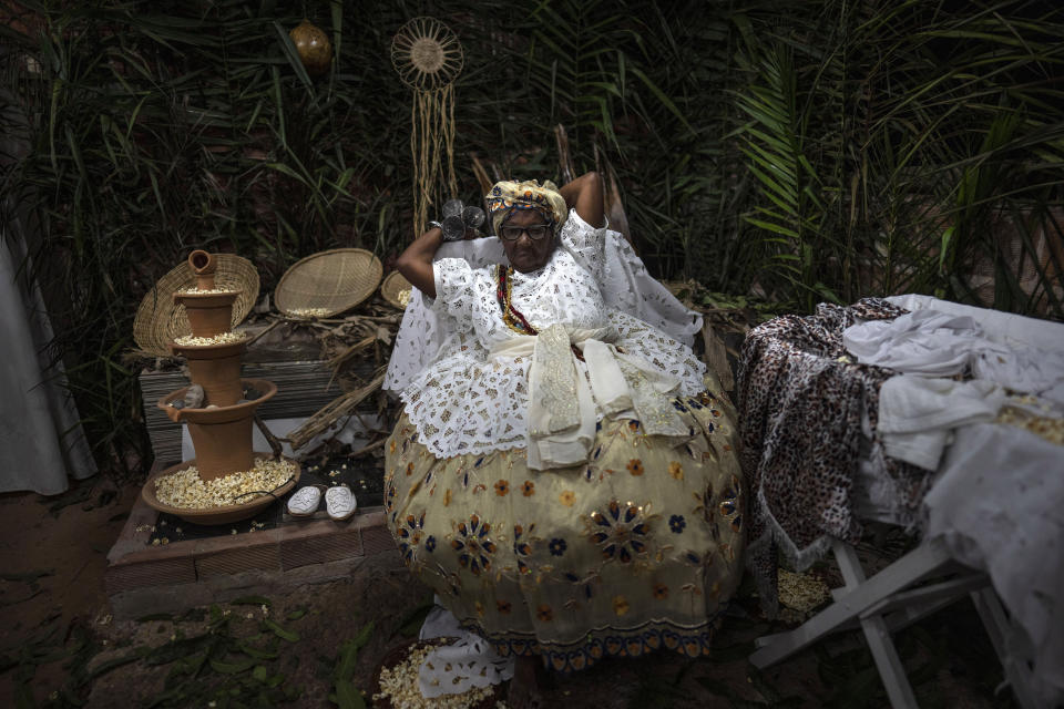 A member of the Afro Brazilian faith Candomble, attends a ritual honoring the diety Obaluae in a temple on the outskirts of Salvador, Brazil, Sunday, Sept. 18, 2022. Today just a small minority practices Afro Brazilian religions. (AP Photo/Rodrigo Abd)