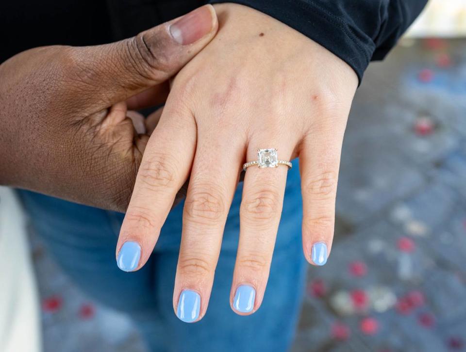 Shelby Ray, 31, shows off her engagement ring at Capitol Park’s World Peace Rose Garden on Sunday, March 3, 2024.