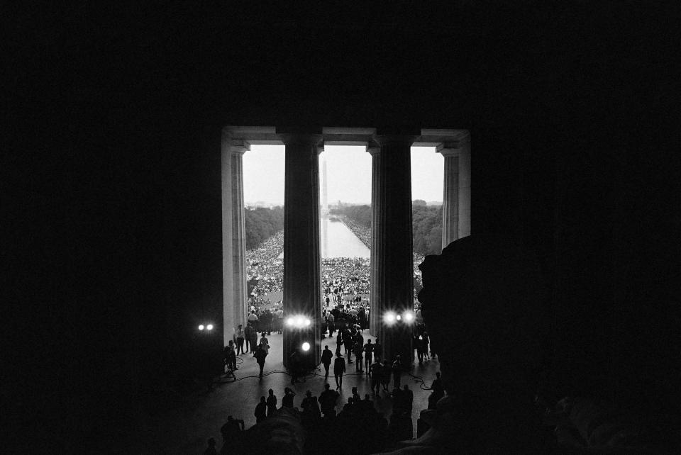 This is a view of the March on Washington crowd made from behind the statue of Abraham Lincoln in the Lincoln Memorial in Washington, August 28, 1963. In the distance is the Washington Monument and the Reflecting Pool. 