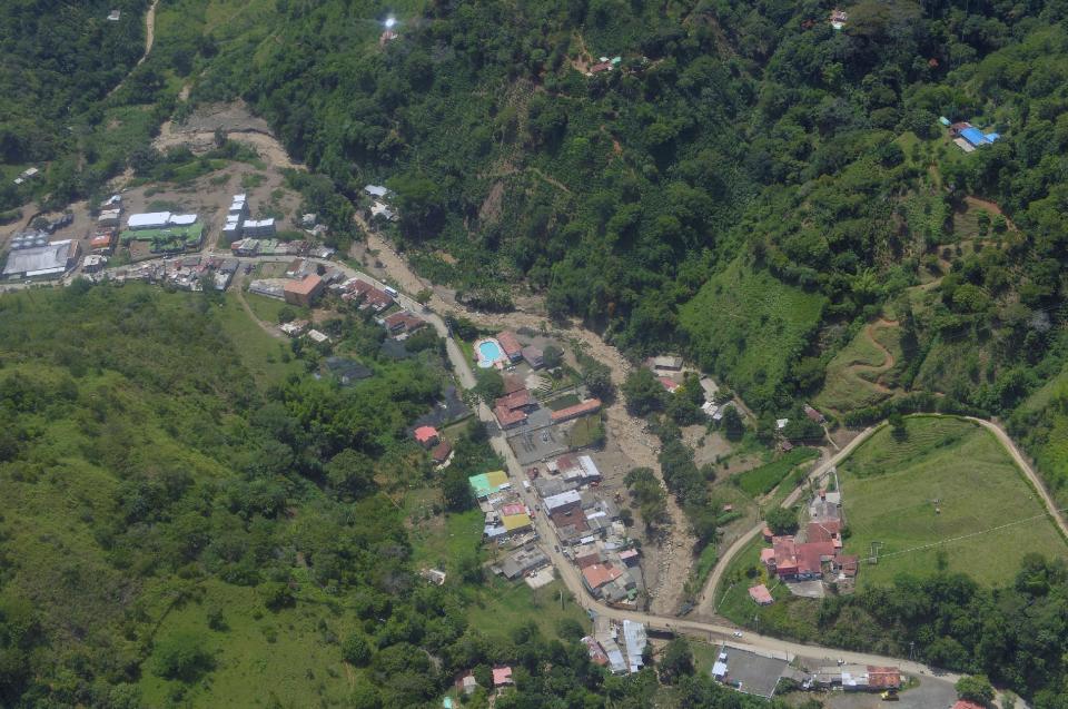 A general view of the municipality of Salgar in Antioquia department after a landslide in this May 18, 2015 handout image provided by Colombian Presidency. A landslide sent mud and water crashing onto homes in a town in Colombia's northwest mountains on Monday, killing at least 48 people and injuring dozens, officials said. Heavy rains caused a ravine to overflow, sending mud and water onto neighboring homes in Salgar. REUTERS/Cesar Carrion/Colombian Presidency/Handout via Reuters ATTENTION EDITORS - THIS PICTURE WAS PROVIDED BY A THIRD PARTY. REUTERS IS UNABLE TO INDEPENDENTLY VERIFY THE AUTHENTICITY, CONTENT, LOCATION OR DATE OF THIS IMAGE. FOR EDITORIAL USE ONLY. NOT FOR SALE FOR MARKETING OR ADVERTISING CAMPAIGNS. THIS PICTURE IS DISTRIBUTED EXACTLY AS RECEIVED BY REUTERS, AS A SERVICE TO CLIENTS.