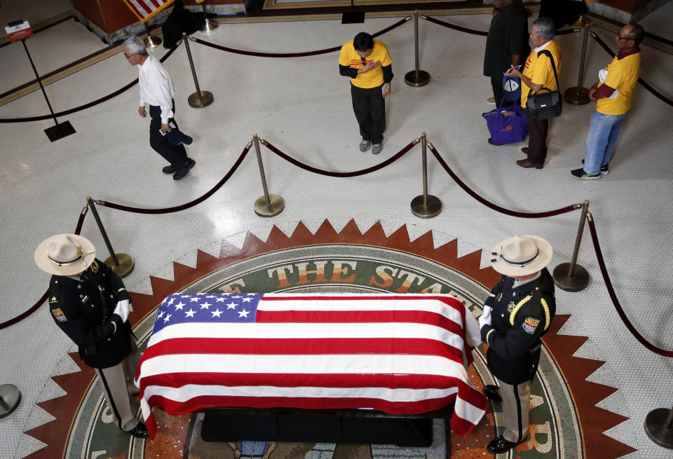 <p>A Vietnamese group from Orange County, Calif., pays their respects near the casket of Sen. John McCain during a viewing at the Arizona Capitol on Wednesday, Aug. 29, 2018, in Phoenix. (Photo: Jae C. Hong/AP) </p>