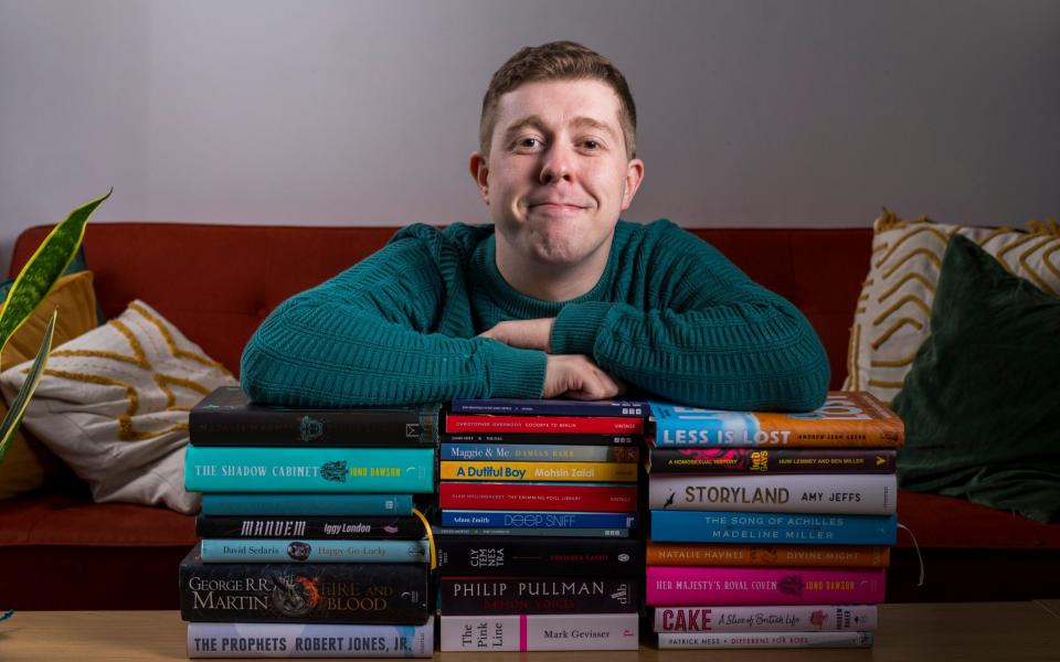 Jack Rear with a stack of books