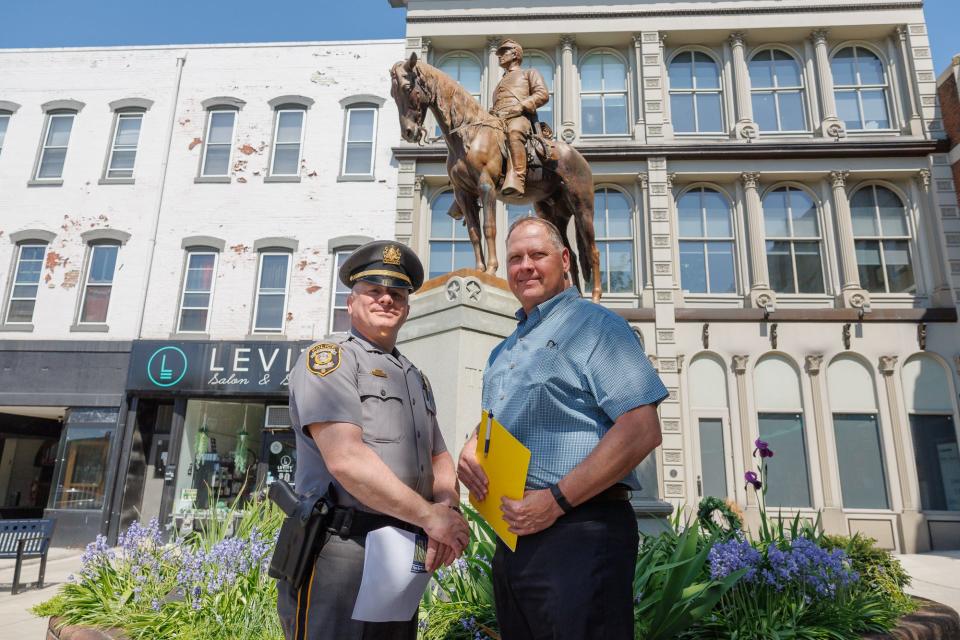 Hanover Borough Police Department Lt. Joseph Bunty, left, poses with Jeff Bowman, law enforcement liaison from the Highway Safety Network, Monday, April 29, 2024, in downtown Hanover Borough.