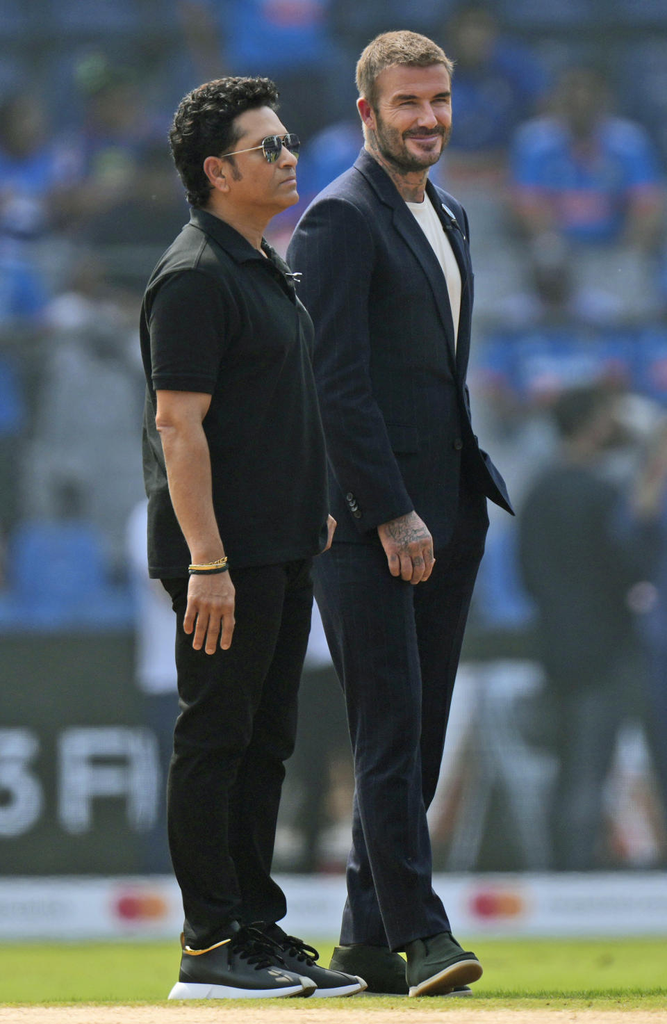 India's Sachin Tendulkar, left, stands next to England soccer player David Beckham before the ICC Men's Cricket World Cup first semifinal match between India and New Zealand in Mumbai, India, Wednesday, Nov. 15, 2023. (AP Photo/Rajanish Kakade)