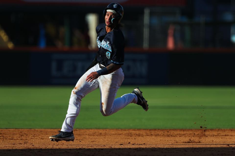 Hooks first baseman Jordan Brewer (8) runs toward third base in a game against Midland on Monday, July 4, 2022 at Whataburger Field in Corpus Christi, Texas.