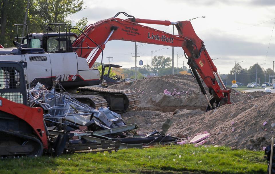Crews work on clearing the lot where Manitowoc Visitor Center was as seen, Thursday, September 28, 2023, in Manitowoc, Wis.