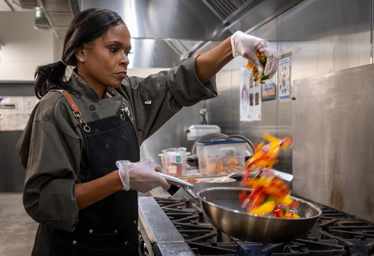 Robin Ray, director of culinary operations at HOSCO/North Sarah Food Hub, prepares lunch in the non-profit’s kitchen in St. Louis, Mo.