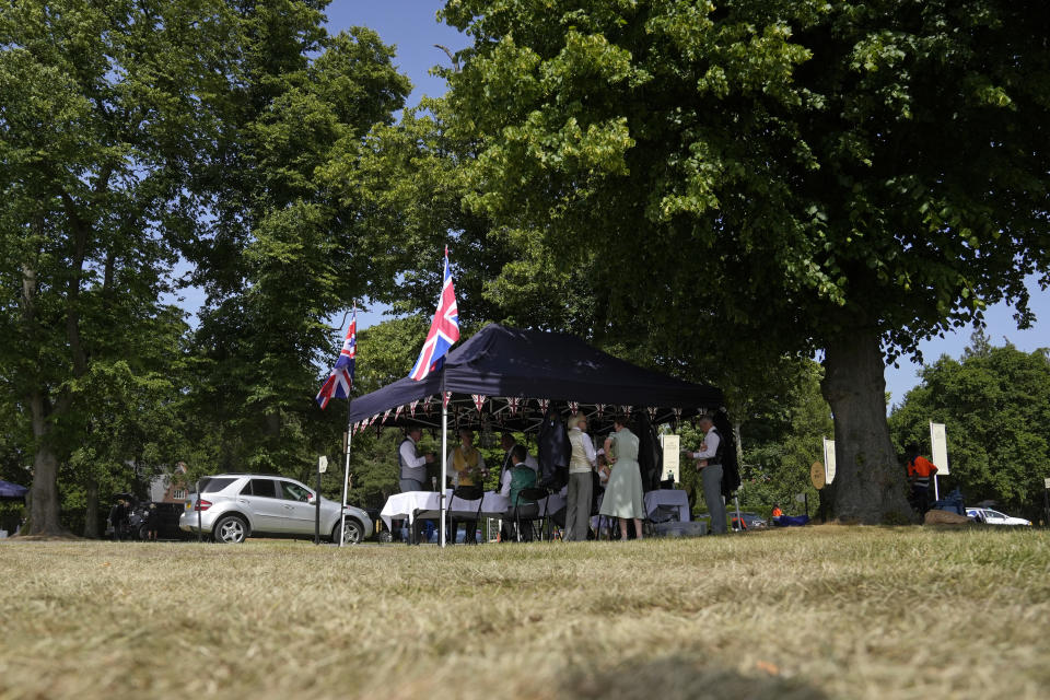 People gather in the carpark for refreshments before the fourth day of the Royal Ascot horserace meeting, at Ascot Racecourse, in Ascot, England, Friday, June 17, 2022. (AP Photo/Alastair Grant)