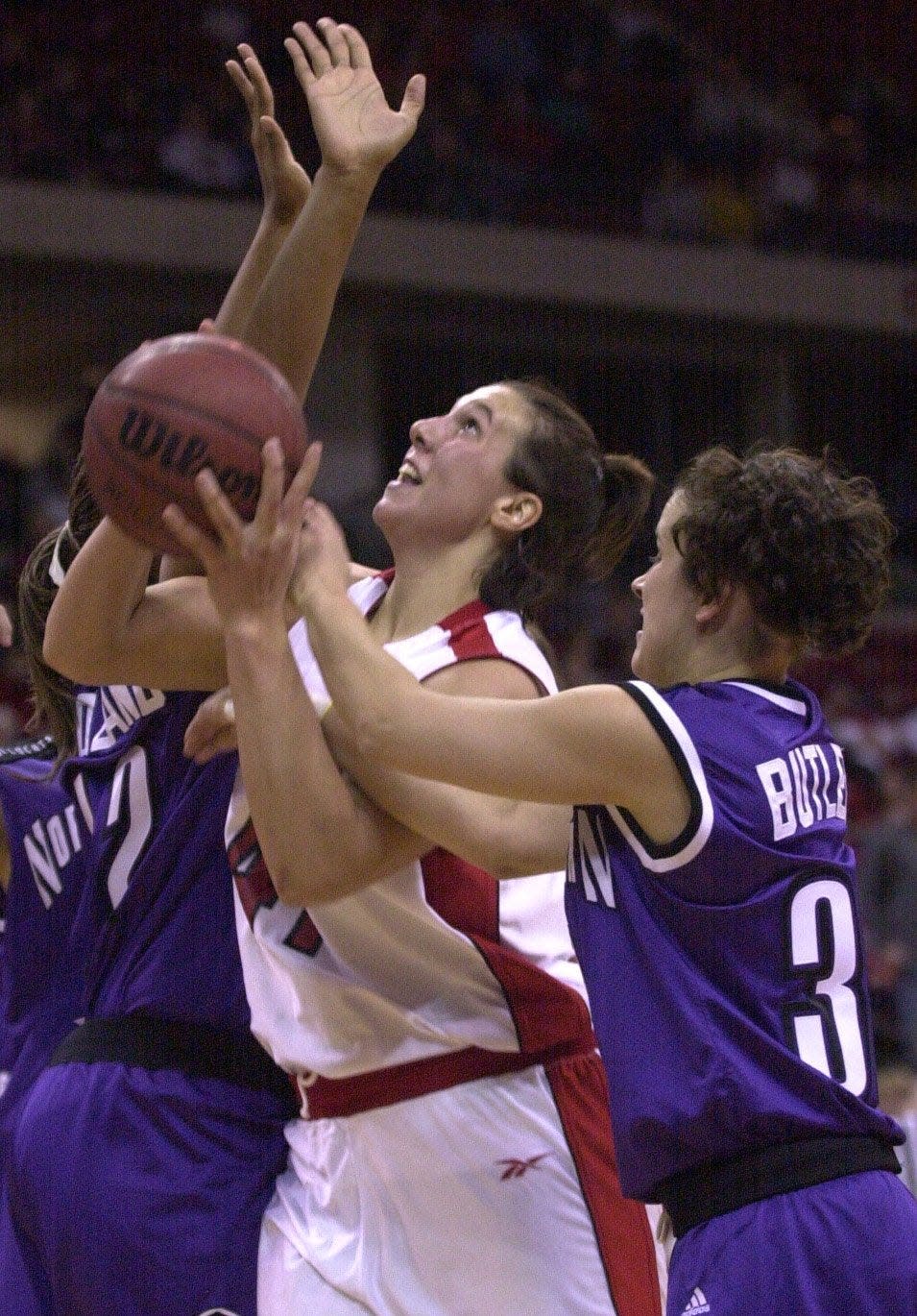 Wisconsin's Jessie Stomski (center) scored 29 points in an NCAA Tournament loss.