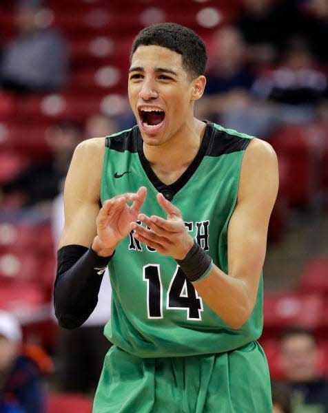 Oshkosh North's Tyrese Haliburton (14) celebrates in the final moments of the Division 1 championship game against Brookfield East at the WIAA 2018 state boys basketball tournament at the Kohl Center on Saturday, March 17, 2018 in Madison, Wis. Oshkosh North won, 61-44.