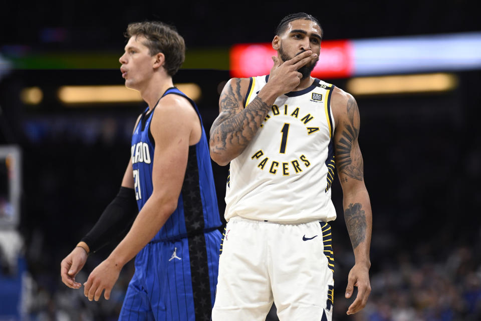 Indiana Pacers forward Obi Toppin (1) celebrates after scoring a 3-point basket as Orlando Magic center Moritz Wagner, left, reacts during the second half of an NBA basketball game, Sunday, March 10, 2024, in Orlando, Fla. (AP Photo/Phelan M. Ebenhack)