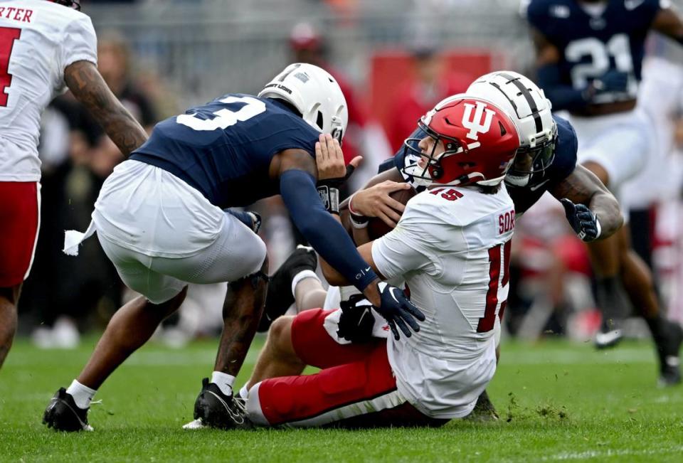 Penn State’s Johnny Dixon and Kobe King stop Indiana quarterback Brendan Sorsby during the game on Saturday, Oct. 28, 2023. A penalty was called on the play.